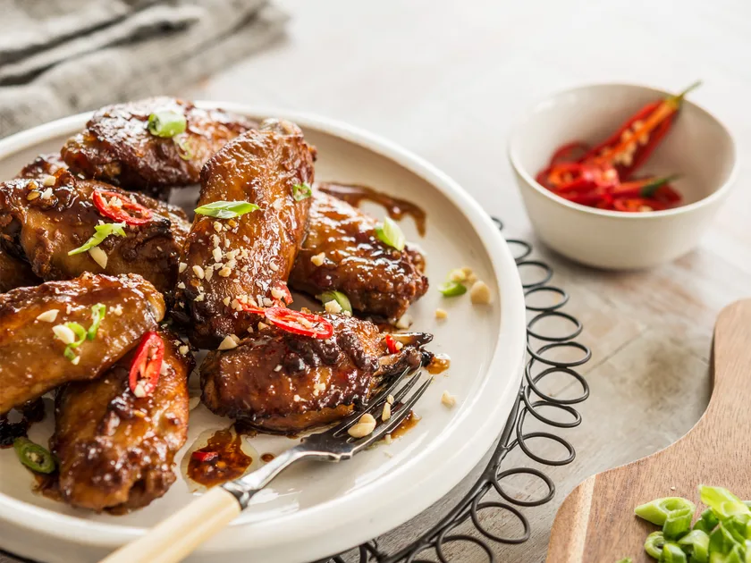 Oven-baked sticky satay chicken nibbles