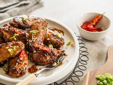 Sticky satay chicken nibbles