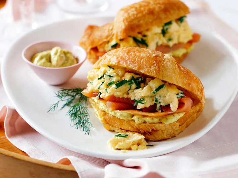 Croissants with herby scrambled eggs and smoked salmon