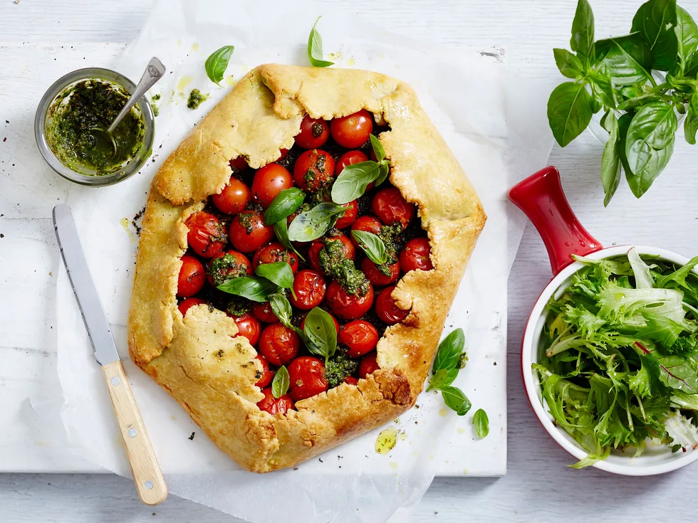 Rustic fresh tomato tart with homemade basil pesto