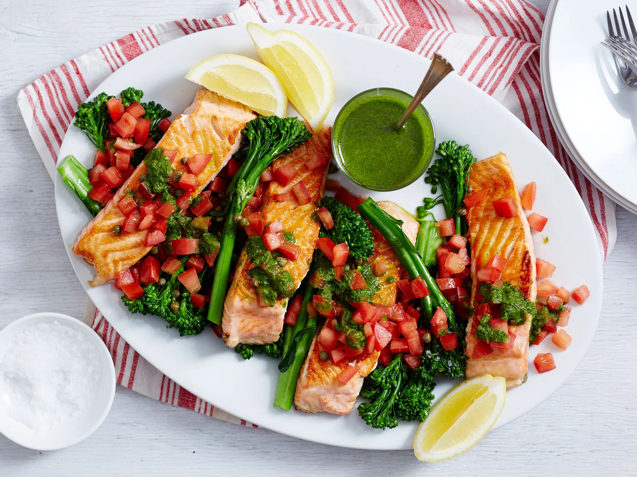 Grilled salmon with tomato, capers and herby sauce