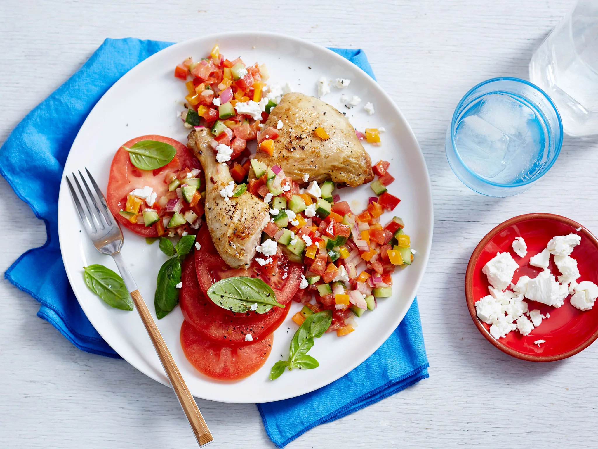 Baked chicken Marylands with tomato salsa and feta