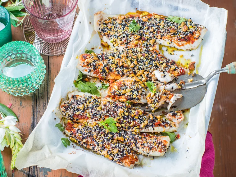 Baked fish with a sesame, pistachio and harissa crust