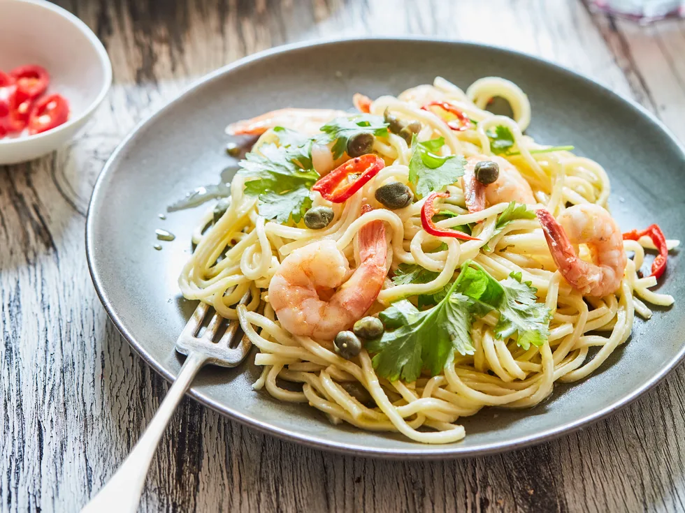 Prawn pasta with garlic, chilli and capers