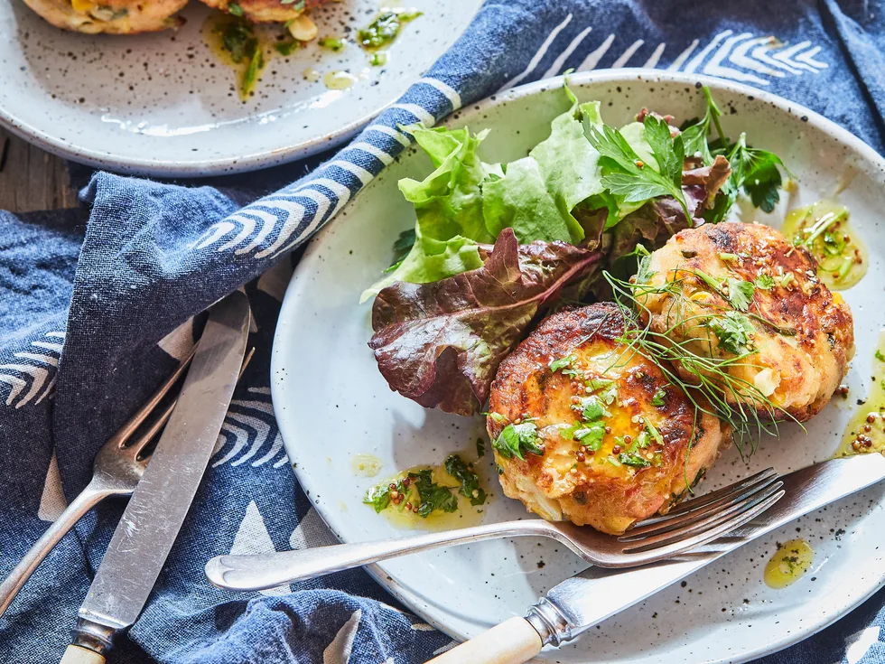 Hot smoked salmon and potato cakes with herby dressing