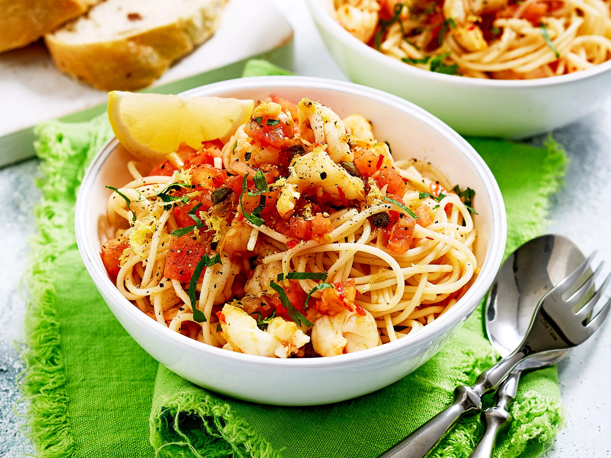 Prawn spaghetti pasta with chilli, capers and tomato