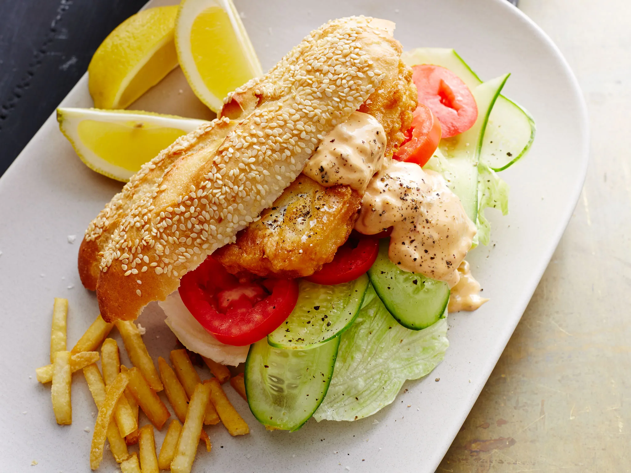 Crispy fish burgers with spicy tomato mayo sauce