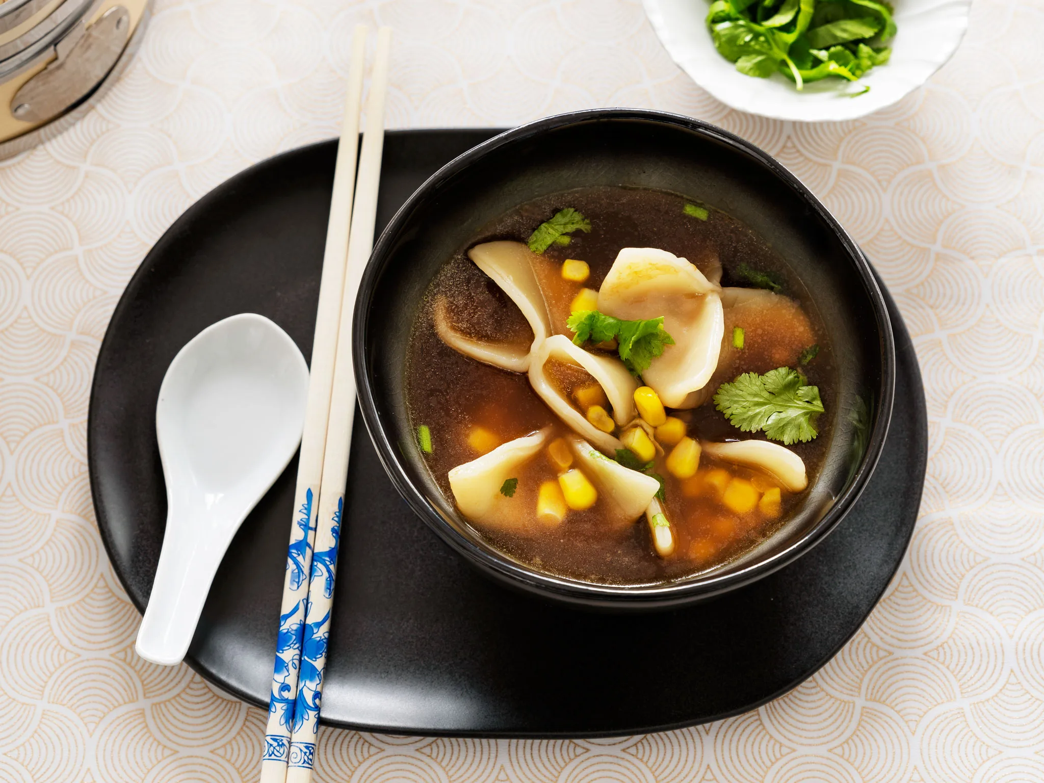 Chicken and sweetcorn dumplings with ginger and soy broth