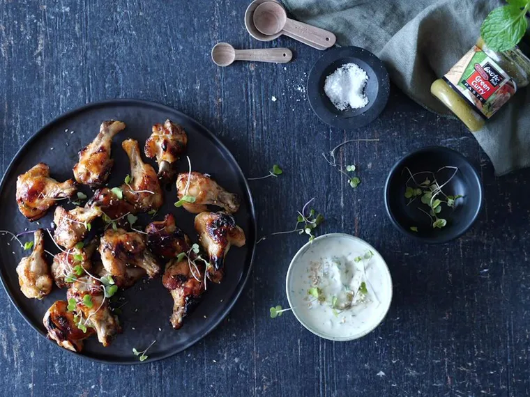 Curry yoghurt dip with sticky chicken nibbles