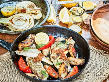 Crispy-skinned fish with harissa dressing