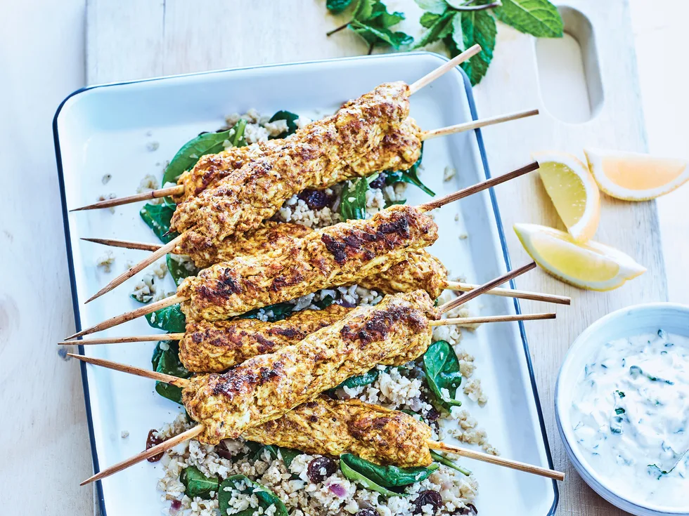 Chicken tikka skewers with raita and cauliflower pilaf