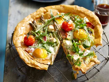 Breakfast tart with eggs, feta, rocket and cherry tomatoes