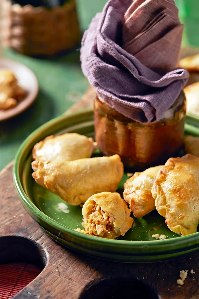 Chicken and leek empanadas on a green plate