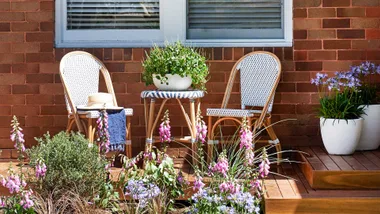 Renovated brick house with front deck and seating area