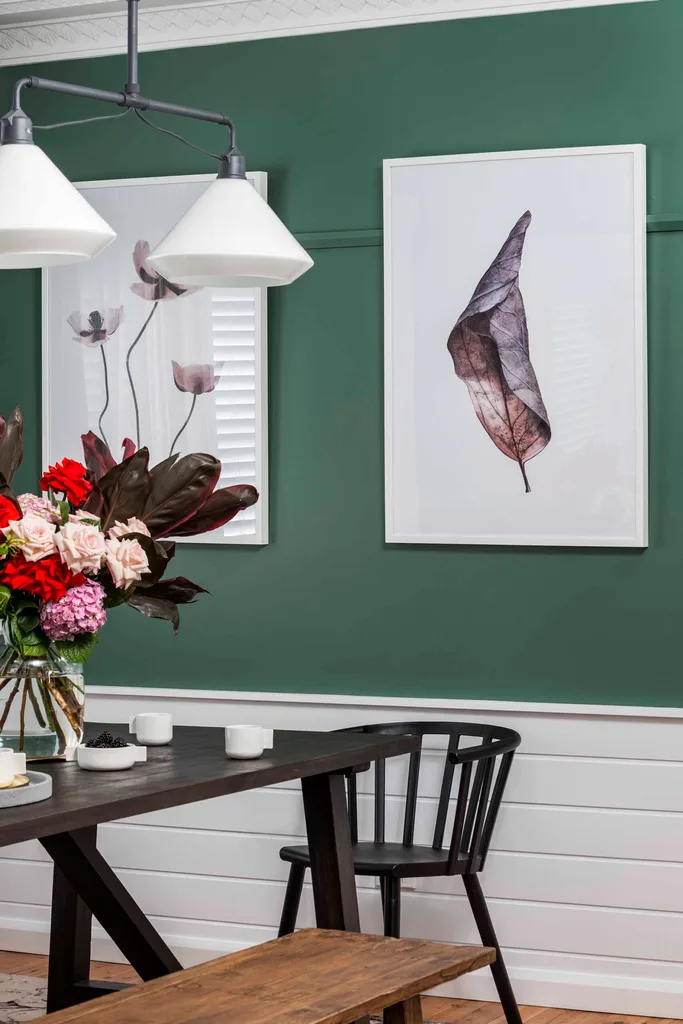 Green, renovated dining room with dado rail and wall moulding