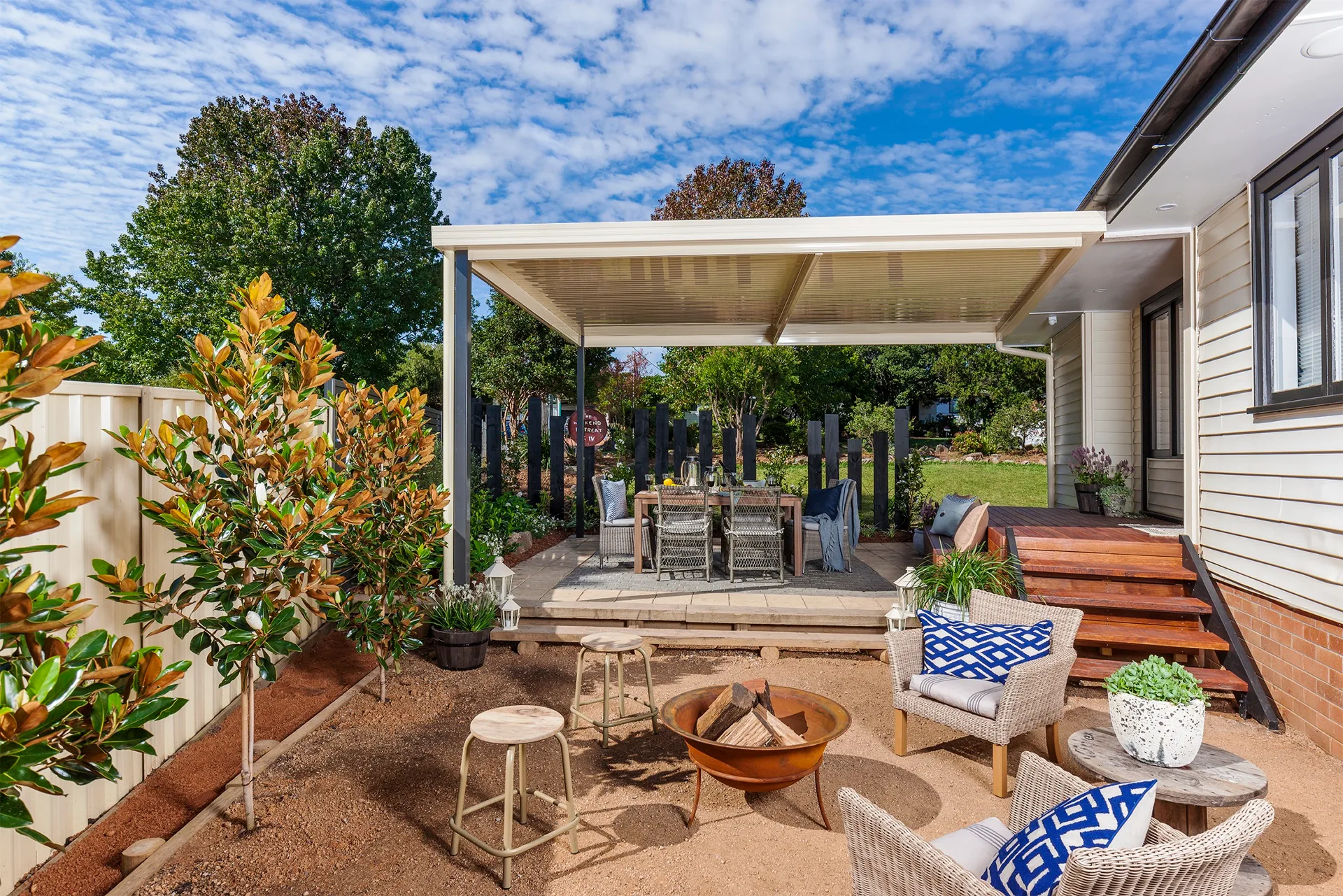 built in pergola with deck out the front and outdoor furniture