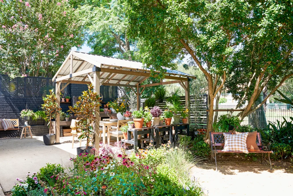 pergola in sunlight with trees surrounding it