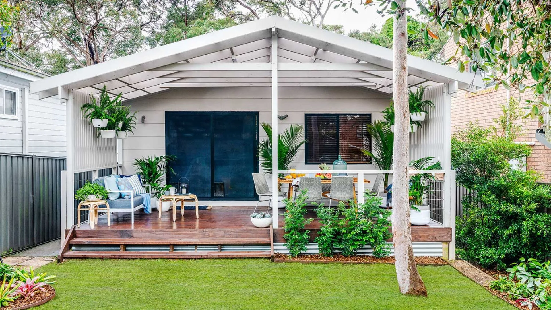 Patio makeover with couch, outdoor dining area and garden