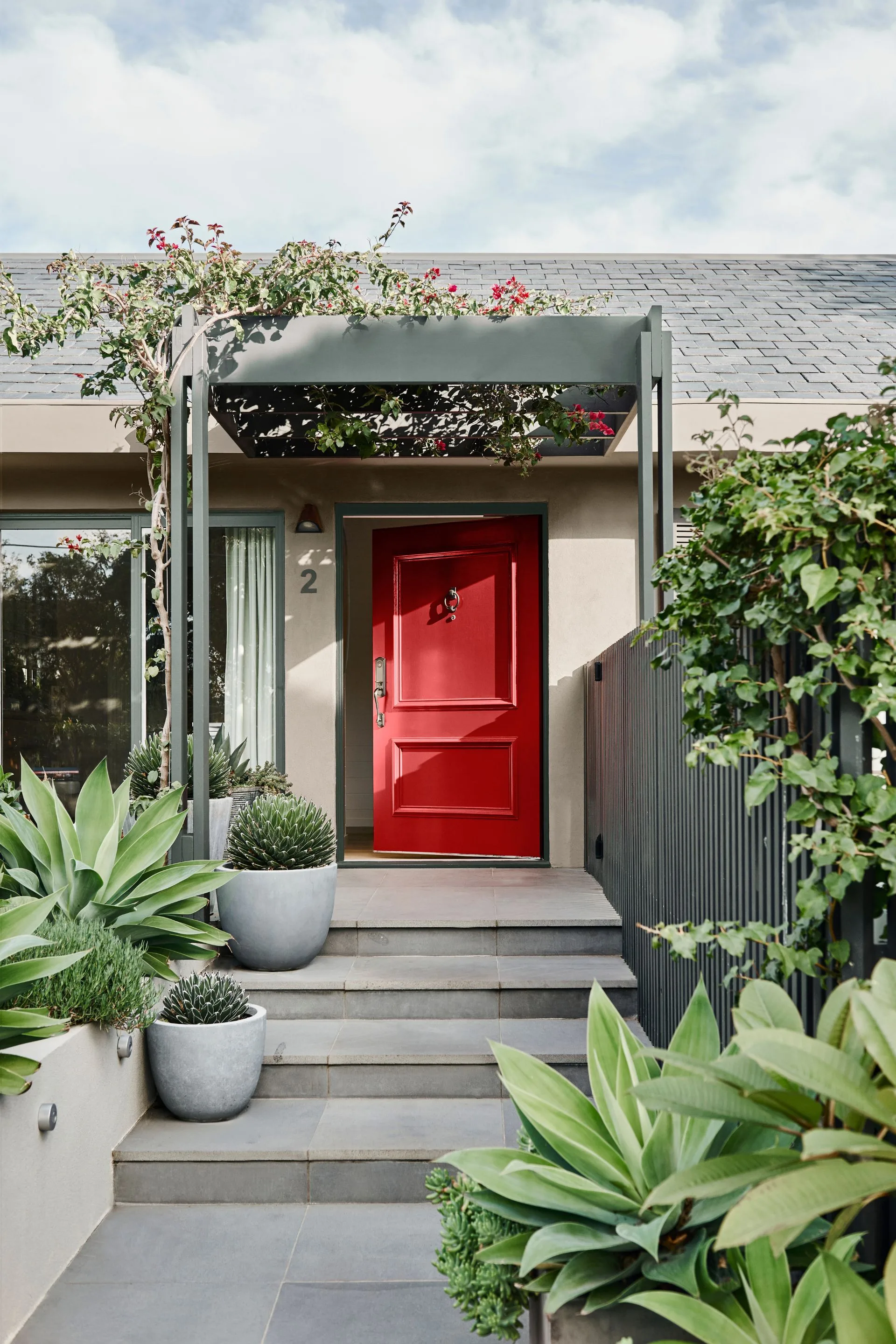 red door on neutral colour house