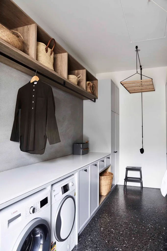 Modern laundry with rail for hanging clothes plus a ceiling-mounted timber clothes airer