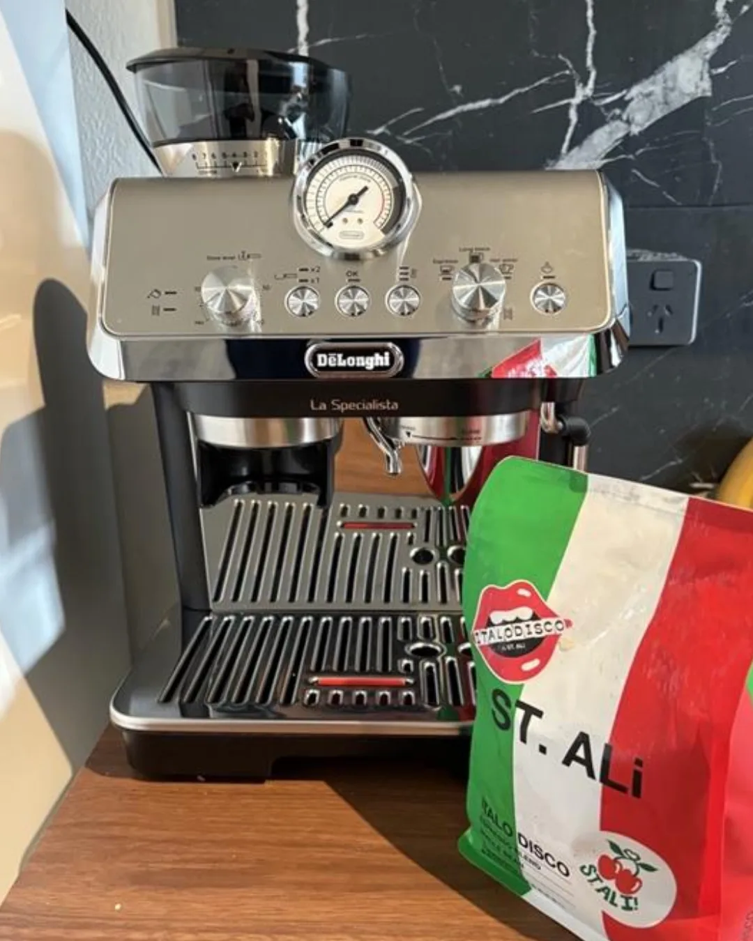 Review De'Longhi Specialista Coffee Machine, Best Coffee Machine for coffee snobs next to a bag of St Ali Coffee Beans
