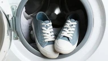blue shoes sitting in a washing machine