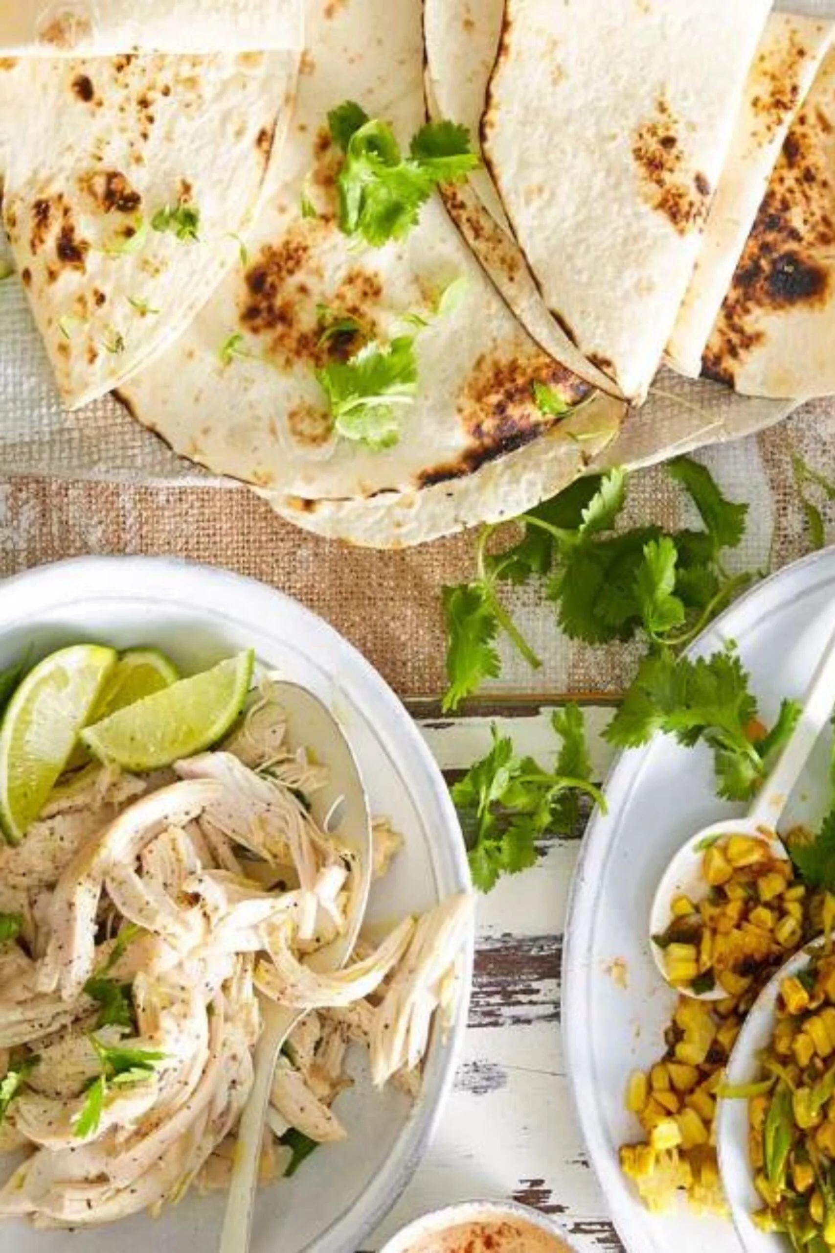 tortillas up top with coriander on them with two bowls on the bottom, filled each with leftover roast chicken and a corn salsa