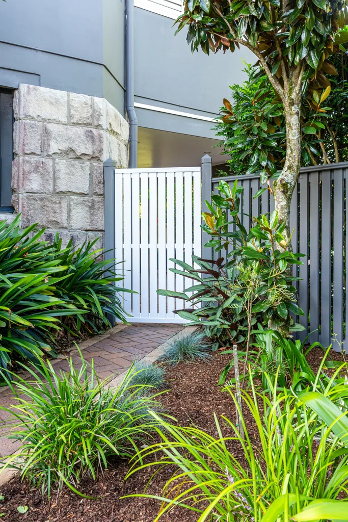 after photo of side gate made with prefabricated metal frame and timber