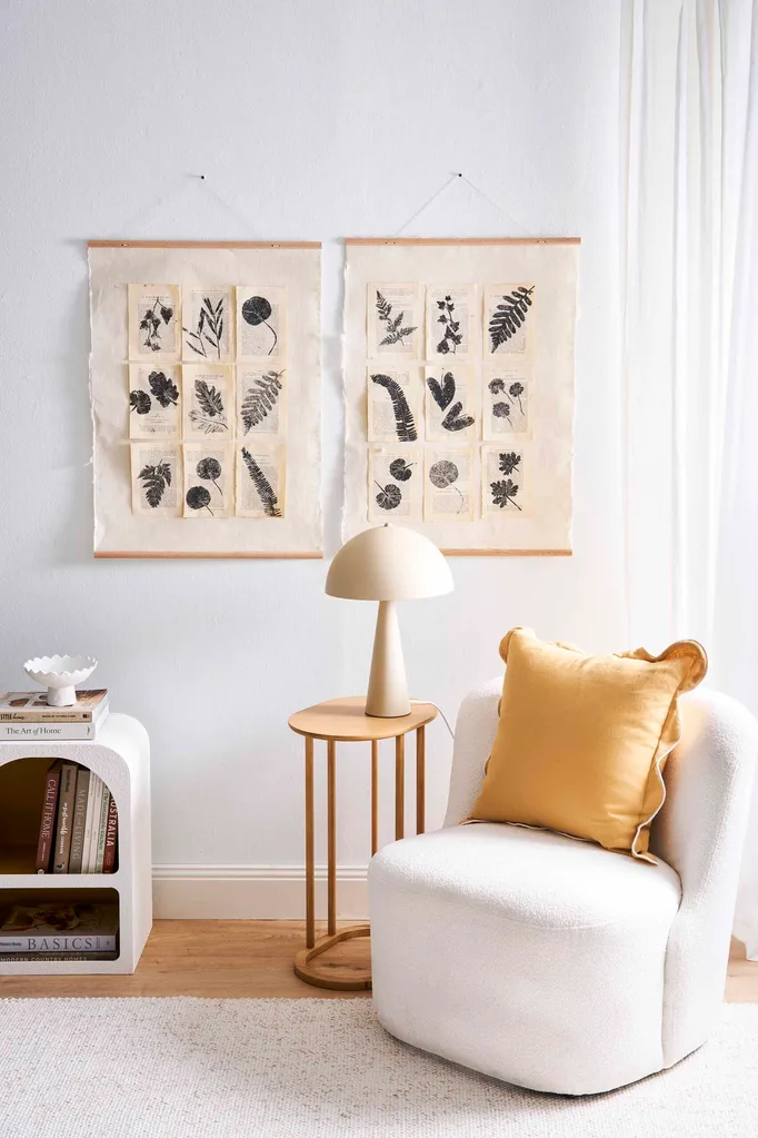 Modern bedroom with fresh white look and DIY leaf wall art