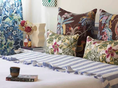 Modern bedroom with a combinatin of striped and floral bedding