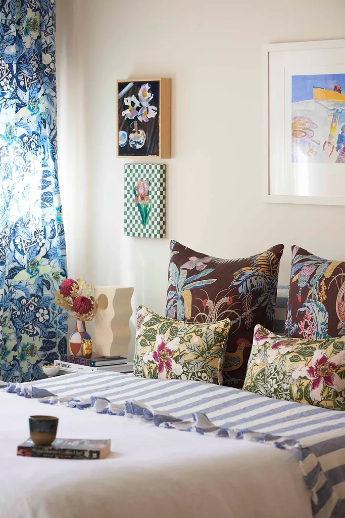 Modern bedroom with a combinatin of striped and floral bedding