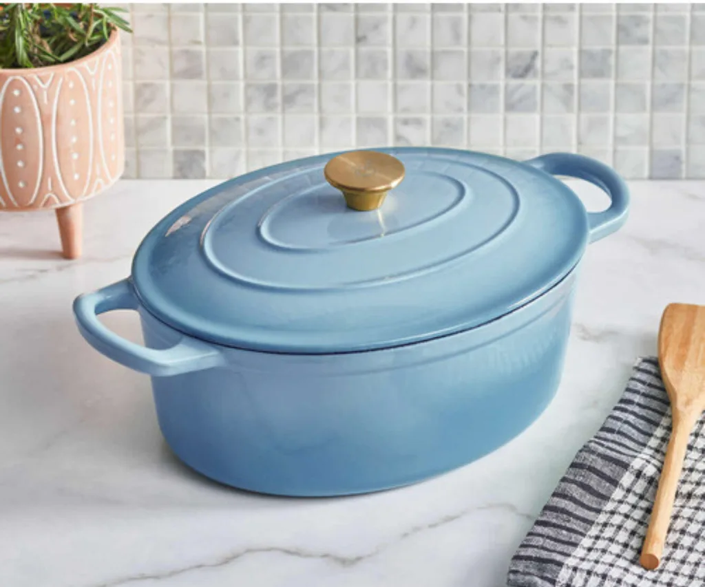 temple and webster black friday sales of blue dutch oven with lid on with wooden spoon on tea towel next to it