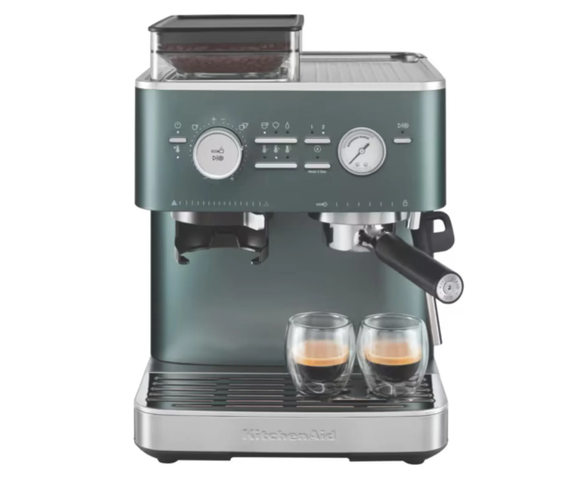 turquoise espresso machine with handle sticking out and two clear espresso cups on it filled with coffee
