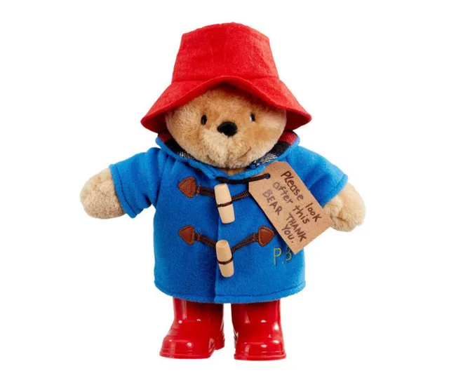 paddington bear plush toy with red hat and blue raincoat