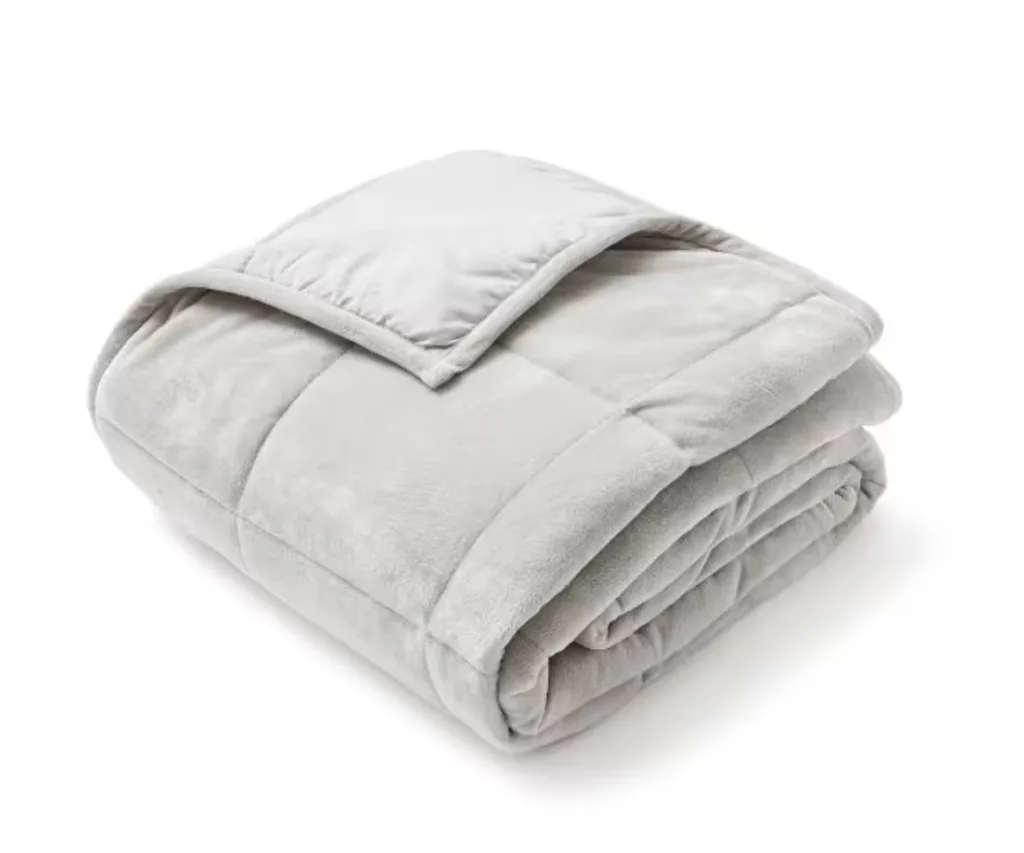 grey kmart fleeced blanket weighted folded with one edge folded over