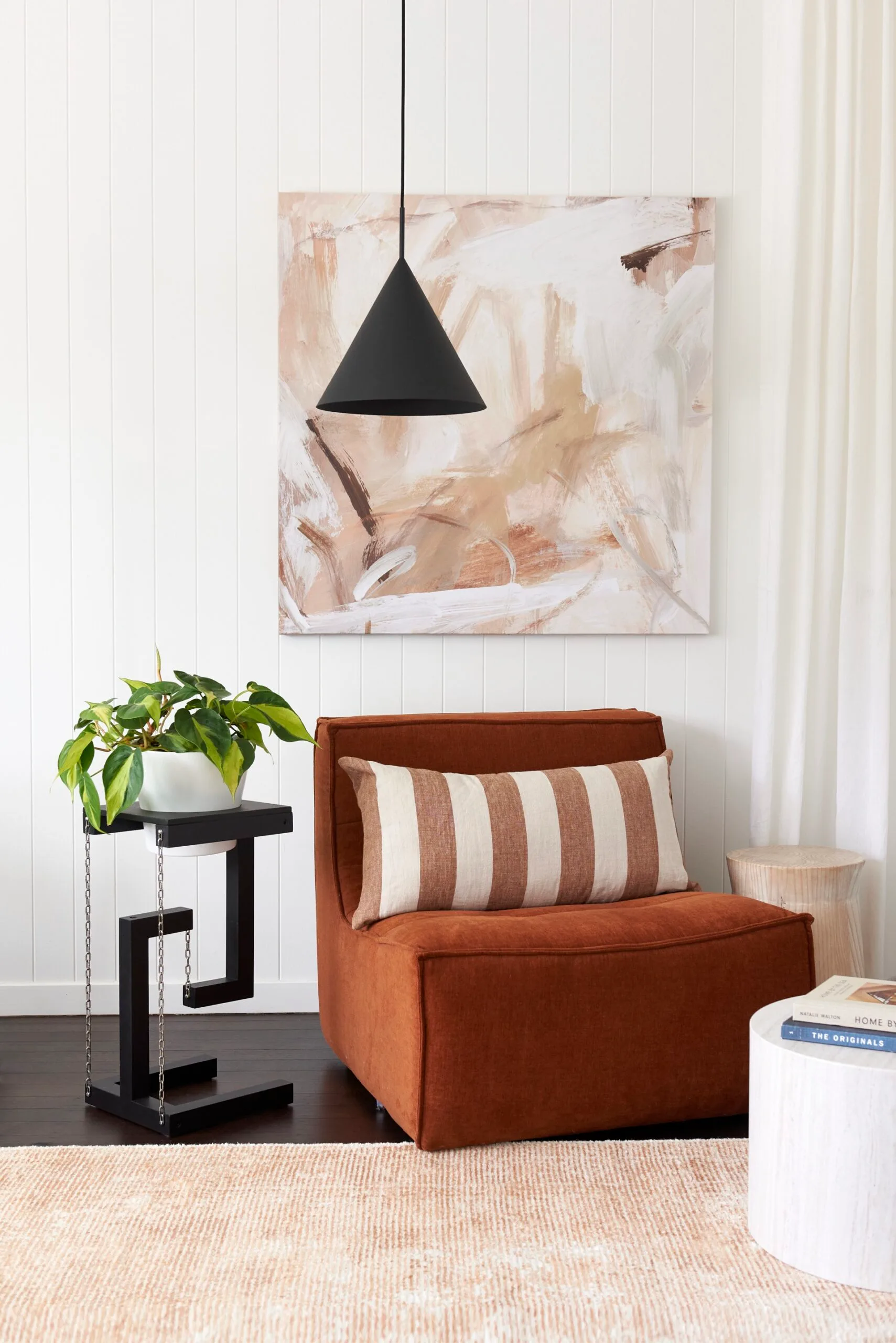 nook corner with armchair pendant light and tensegrity shelf