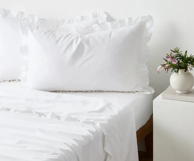 white ruffle sheet set from target with ruffles around pillow