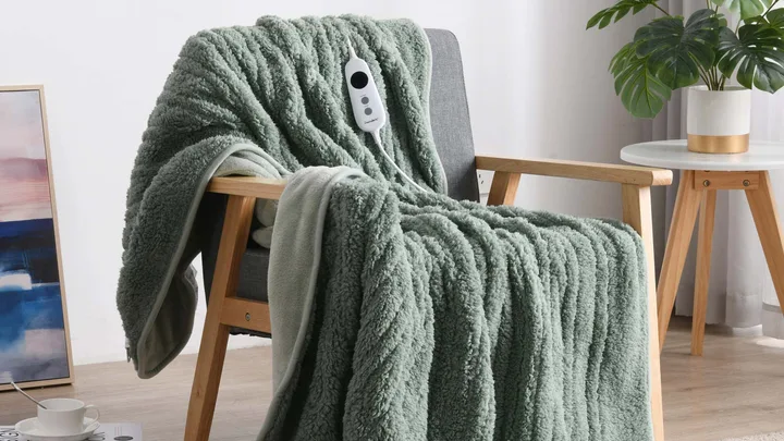 A sage green heated blanket soft cosy throw