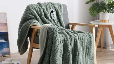 A sage green heated blanket soft cosy throw