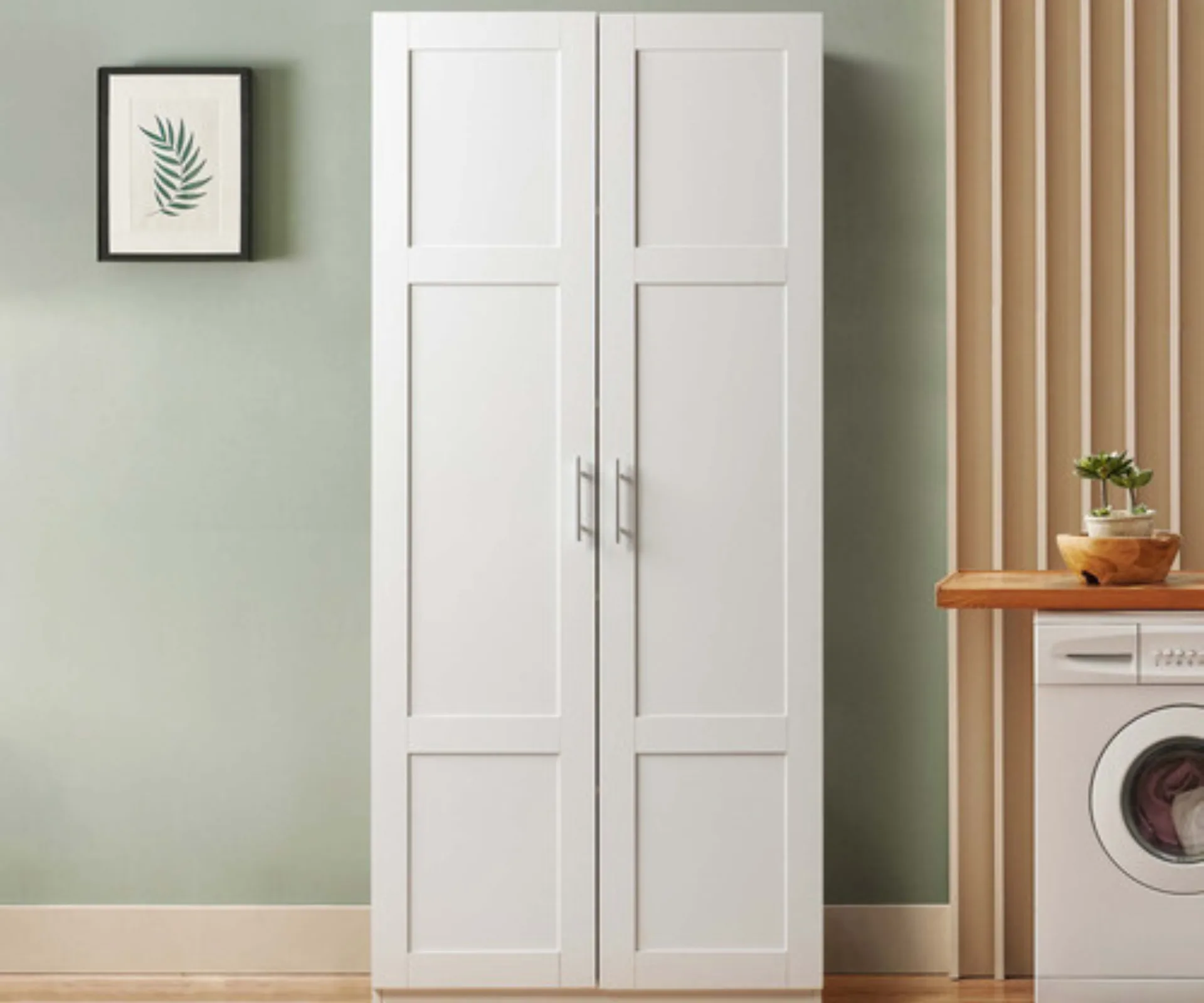 white two door cupboard with wood panelling and green wall behind it