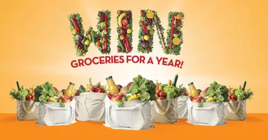 "Text 'Win Groceries for a Year!' with bags of assorted groceries on orange background."