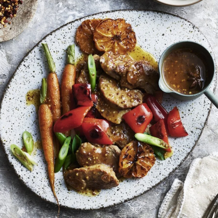 mandarin pork with vegetables on round plate