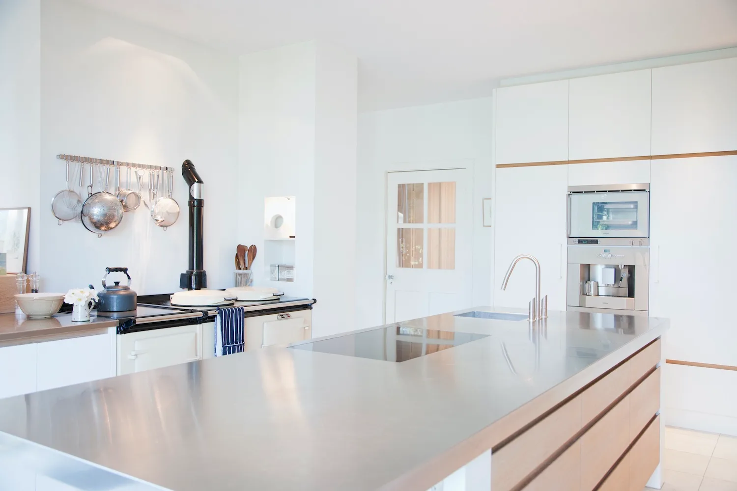 Stainless steel kitchen benchtop ideas can include brushed or polished finishes.