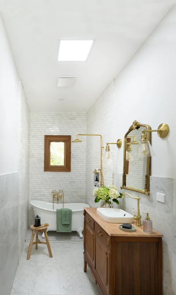 bathroom with old chest of drawers, mirror and alternative skylight on ceiling