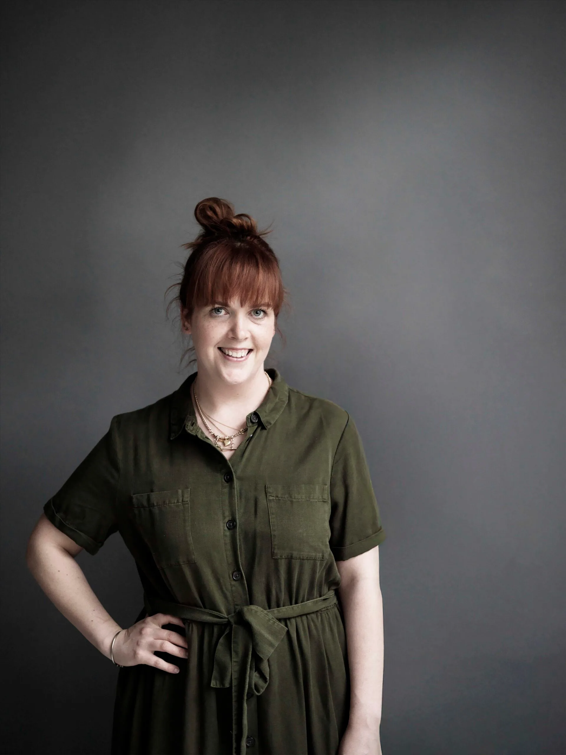 Portrait of Jessica Brook in a green dress.