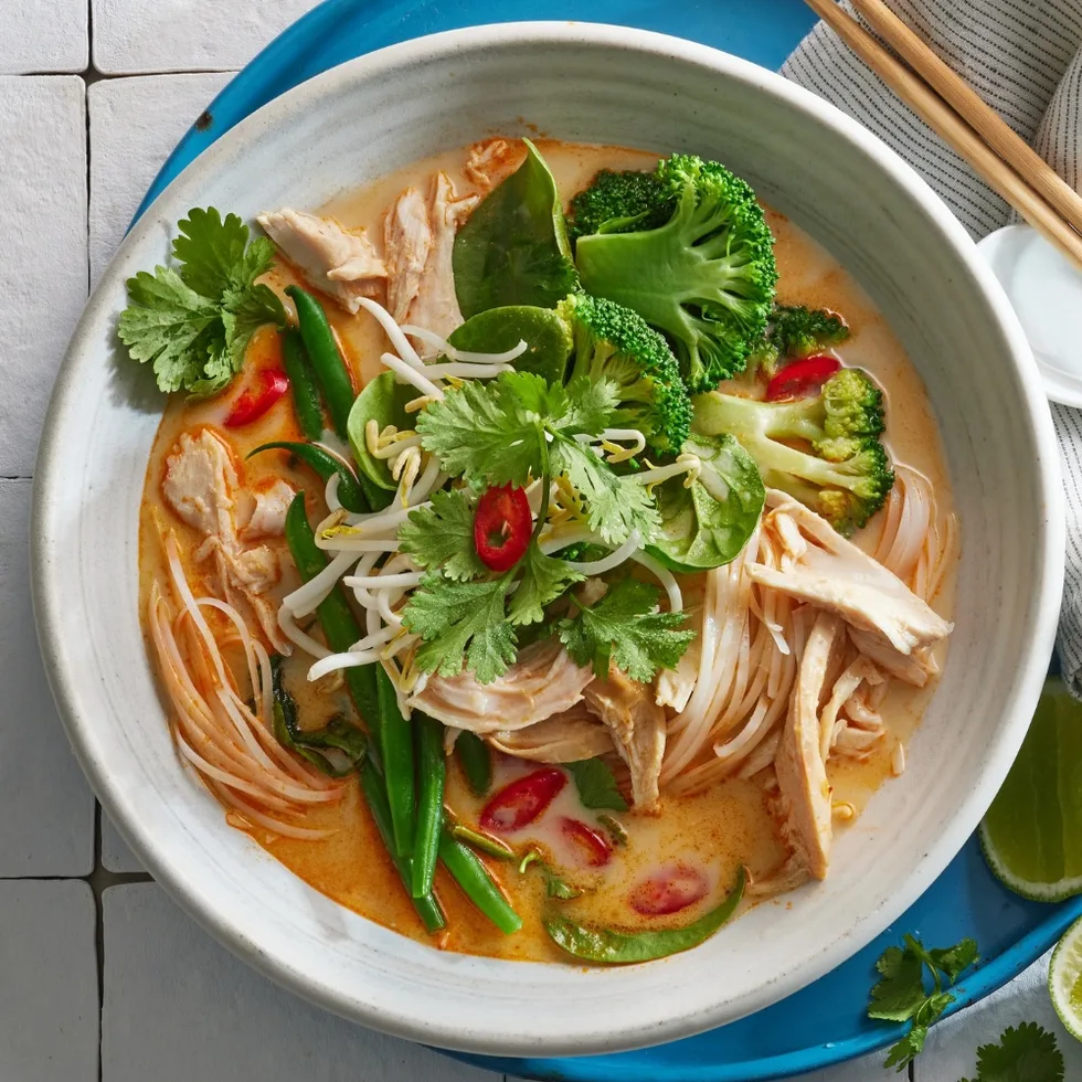 Close up overhead shot of bowl of chicken laksa