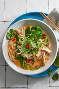 Close up overhead shot of bowl of chicken laksa