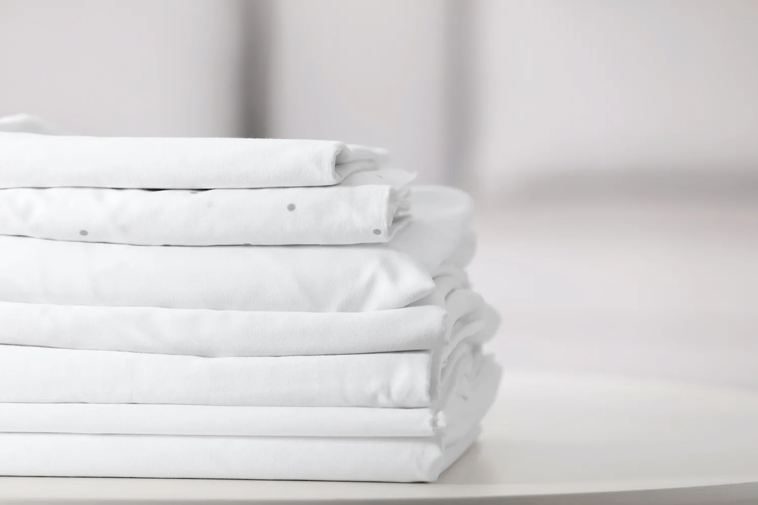 Neatly folding fitted sheets could be easier than you realise.
