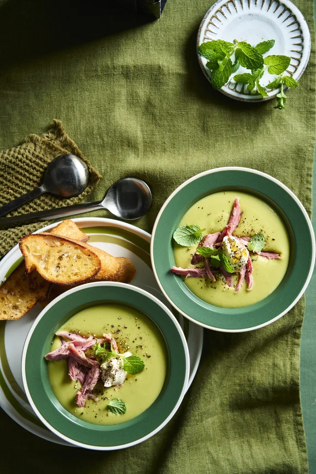 pea and ham soup in green bowls
