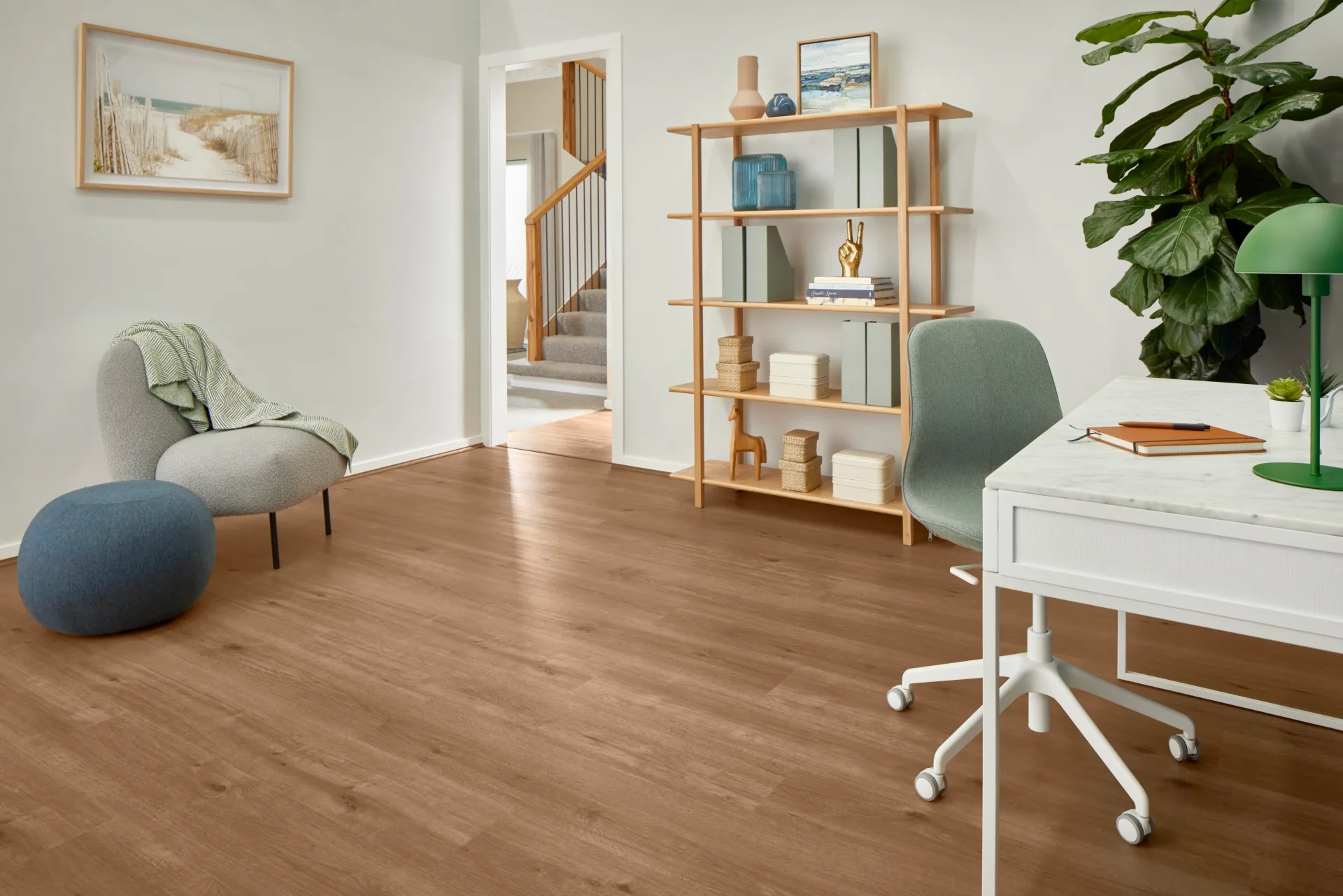 work from home space with green swivel chair and chocolate engineered timber flooring